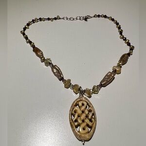 Elegant Beaded Necklace with Intricate Pendant